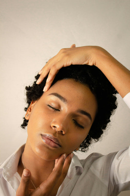 Woman with healthy natural hair — scalp care is the foundation of hair growth and moisture retention
