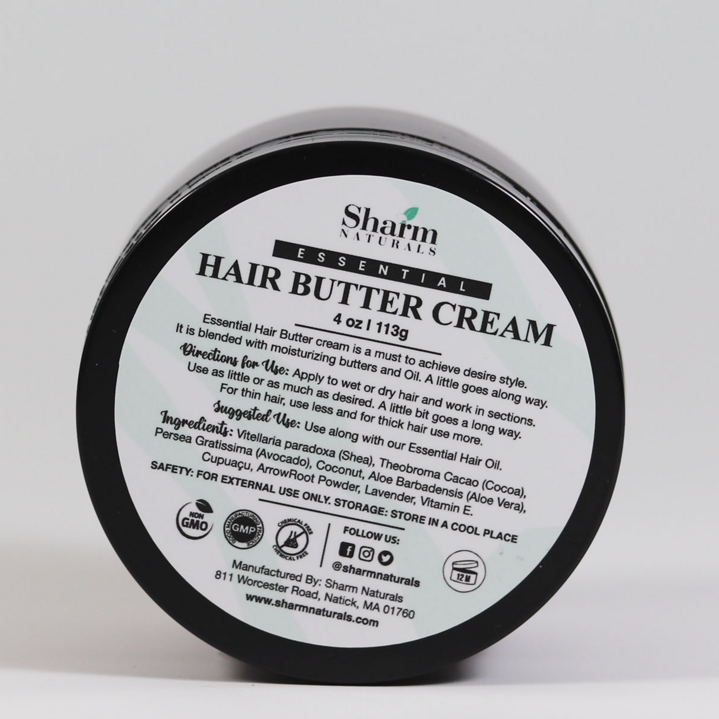 A container of Essential Hair Butter Cream by Sharm Naturals, with product information and ingredients listed on the label.